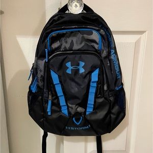 Under Armour Blue, black, and grey Large camouflage backpack.